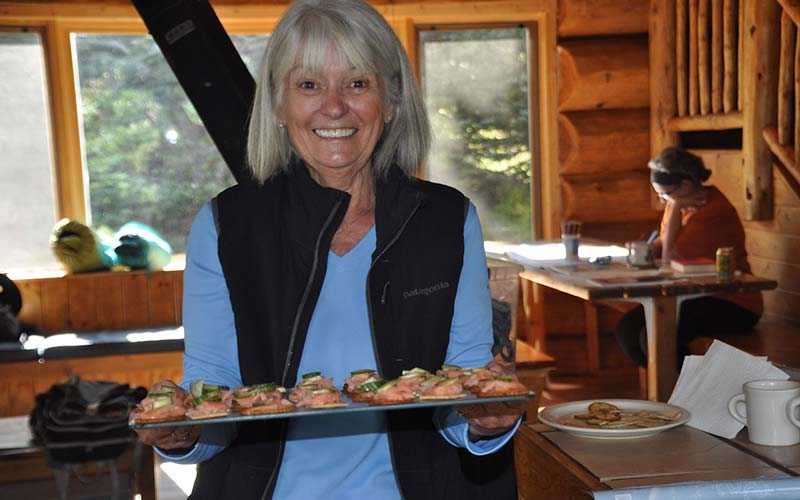 A volunteer with appetizers at Francie's retreat